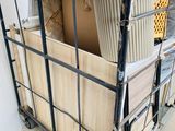 a metal cart with a lot of items inside of it