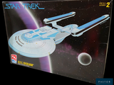 a box with a model of a star trek ship in it