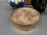 two vases that are sitting on a table next to each other