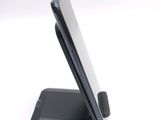 a cell phone that is sitting on top of a stand