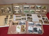 a lot of old photographs on the table