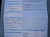 une photo d'un ticket de caisse posé sur un siège de voiture