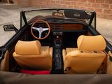 a car that is sitting in a garage with leather seats and a steering wheel