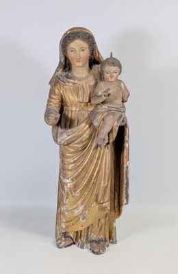an image of a statue of a woman holding a baby