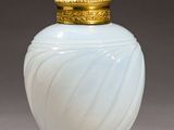 pair of white and gold glass vases with a gold lid