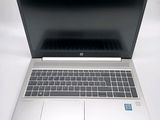 an open laptop computer sitting on top of a white table