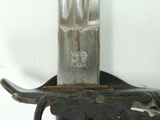 a knife that is sitting on top of a knife holder