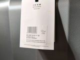a label on a piece of luggage that is hanging on a wall