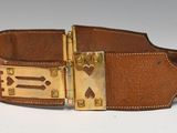 brown leather dog collar with brass hardware and paw prints
