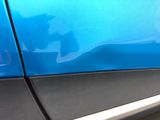 a close up of a car ' s door handle and door handle