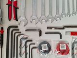 tools laid out on a white surface including wrens, pliers, pliers, pliers, pliers, pliers, pliers, pliers,