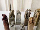 a lot of small sculptures on a table