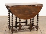 a close up of a table with a wooden top on a wooden floor
