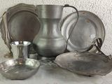 a lot of silver items on a table with a white background