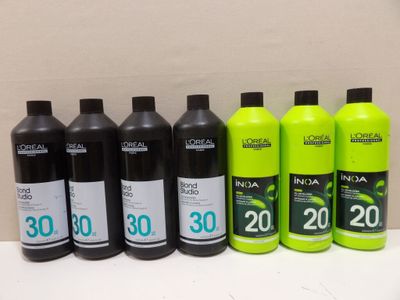 a group of bottles of liquid sitting on top of a counter