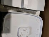 a white box with a white lid sitting on top of it