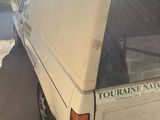 a white van that is parked on the side of the road