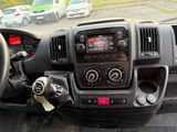 a dashboard view of a car with a steering control