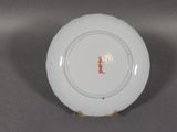 an image of a white plate with red writing on it