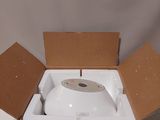 a box with a toilet inside of it on a table