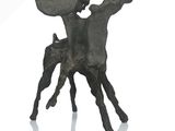 a statue of a man riding a horse holding a shield