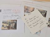 a lot of letters and pictures on the table