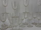 a lot of wine glasses sitting on a table