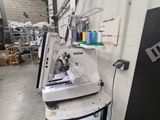 an image of a sewing machine in a warehouse