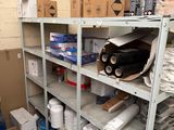 many boxes and supplies on the shelves in the warehouse