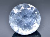 une image représentant un diamant bleu posé sur un socle noir