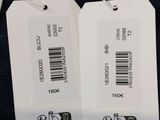 two tags on the back of a black sweater