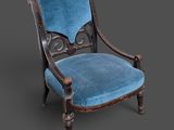 une vieille chaise dont l'assise est recouverte de velours bleu