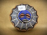 a picture of a decorated cookie with a face on it