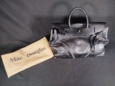 black leather handbag with a leather tag and a brown leather pouch
