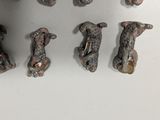a group of dog figurines on a white surface