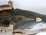 a close up of a gun that is on a table