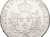 a silver coin with a crown on top of it