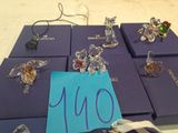 a lot of different rings on a table with a note