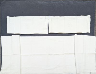 a picture of a piece of white cloth on a black surface