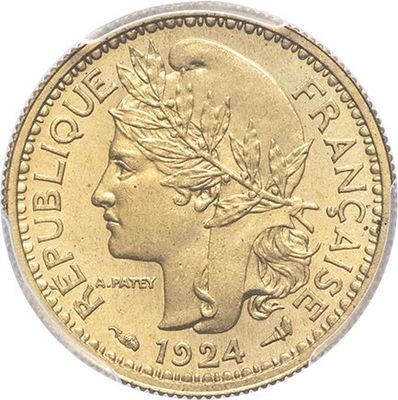 a gold coin with a woman ' s head on it
