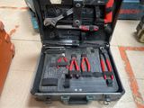 a tool case with tools in it sitting on the floor