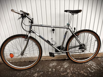 a bike that is parked against a wall