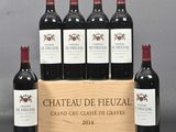 six bottles of red wine in a wooden crate on a table