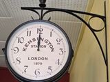 a clock hanging from the side of a building