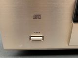 a close up of a silver electronic device sitting on top of a table