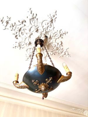 a chandelier hanging from the ceiling in a room