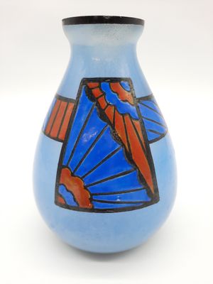 a blue vase with a red and blue design on it