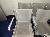 four chairs that are sitting in the corner of a room
