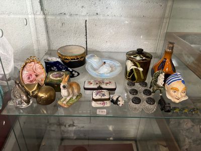 a glass display case with a lot of items on it