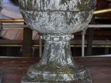 two vases that are sitting on a table